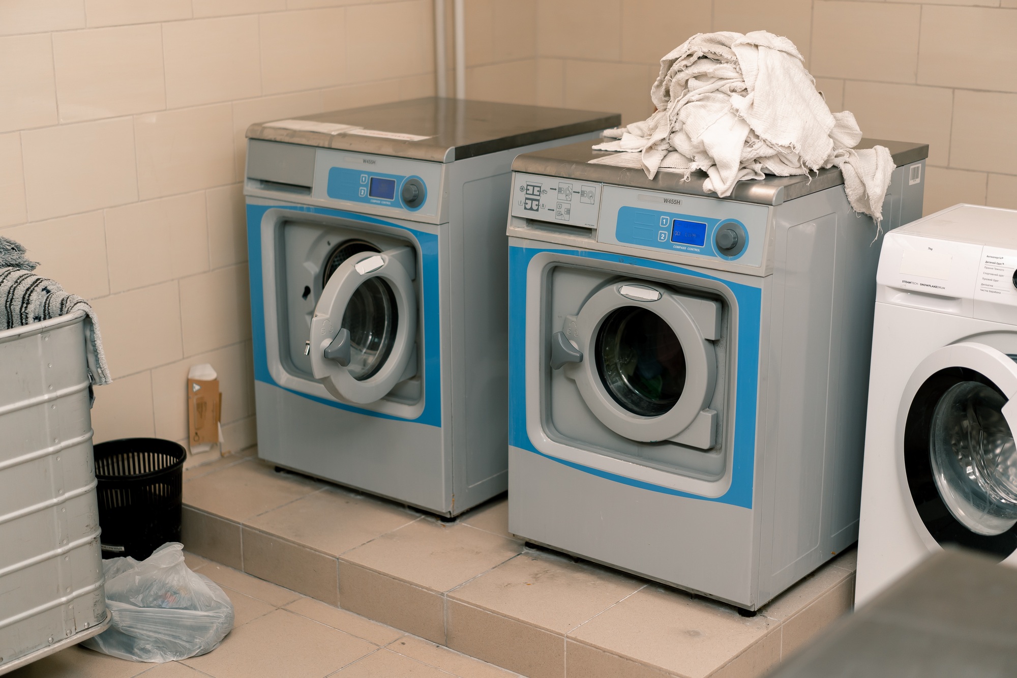 industrial washing machine Hotel laundry services Clothes dryer concept of cleanliness hospitality
